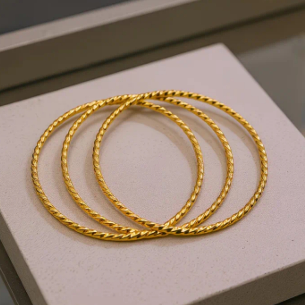 18 Kt Gold Over Titanium Twisted Bangles 18 Kt Gold Over Titanium Twisted Bangles